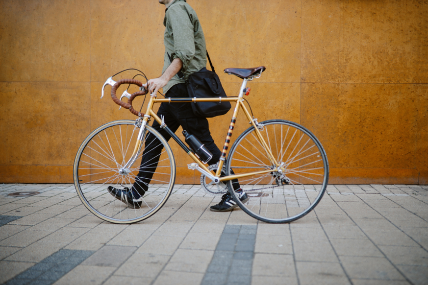 Person walking with bicycle